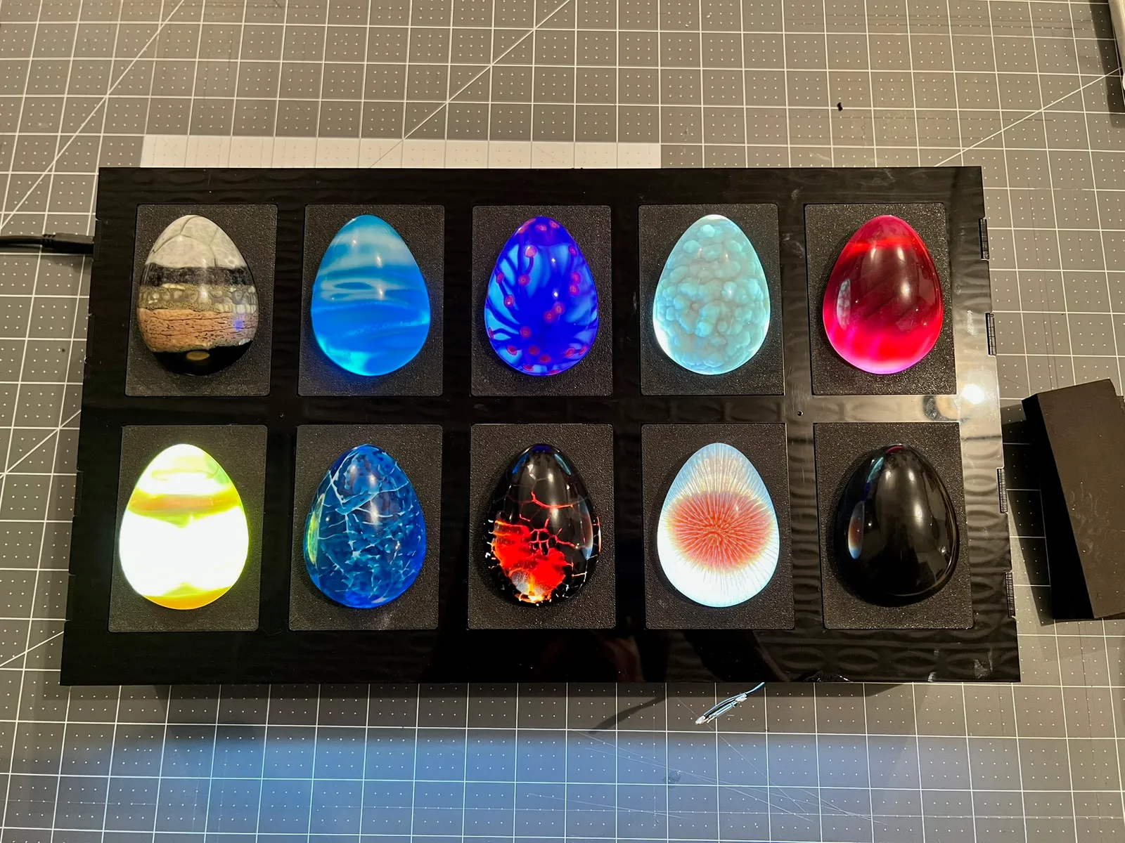 10 Roblox eggs illuminated on a cutting mat