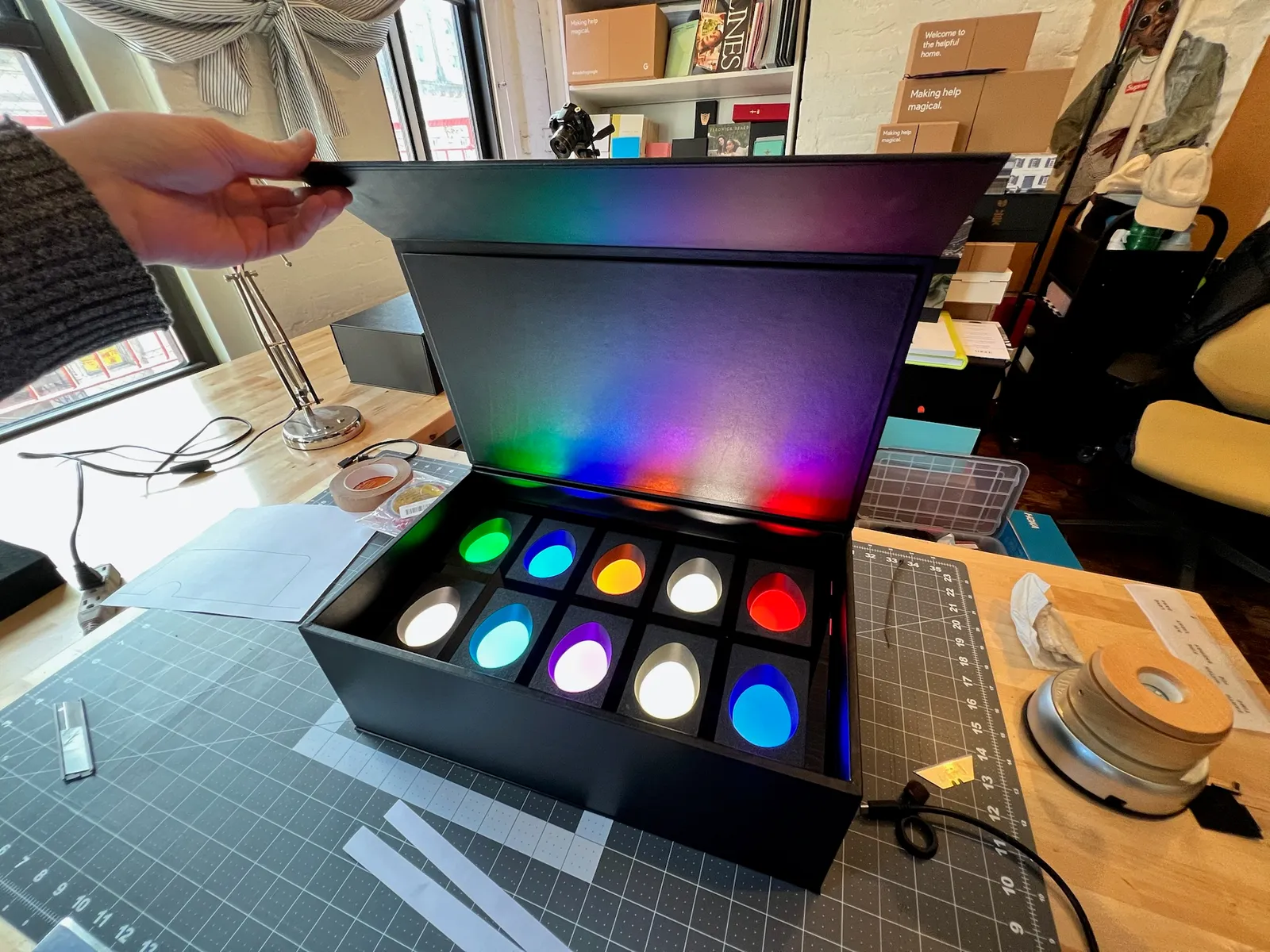 Open box with colorful illumination for 10 eggs