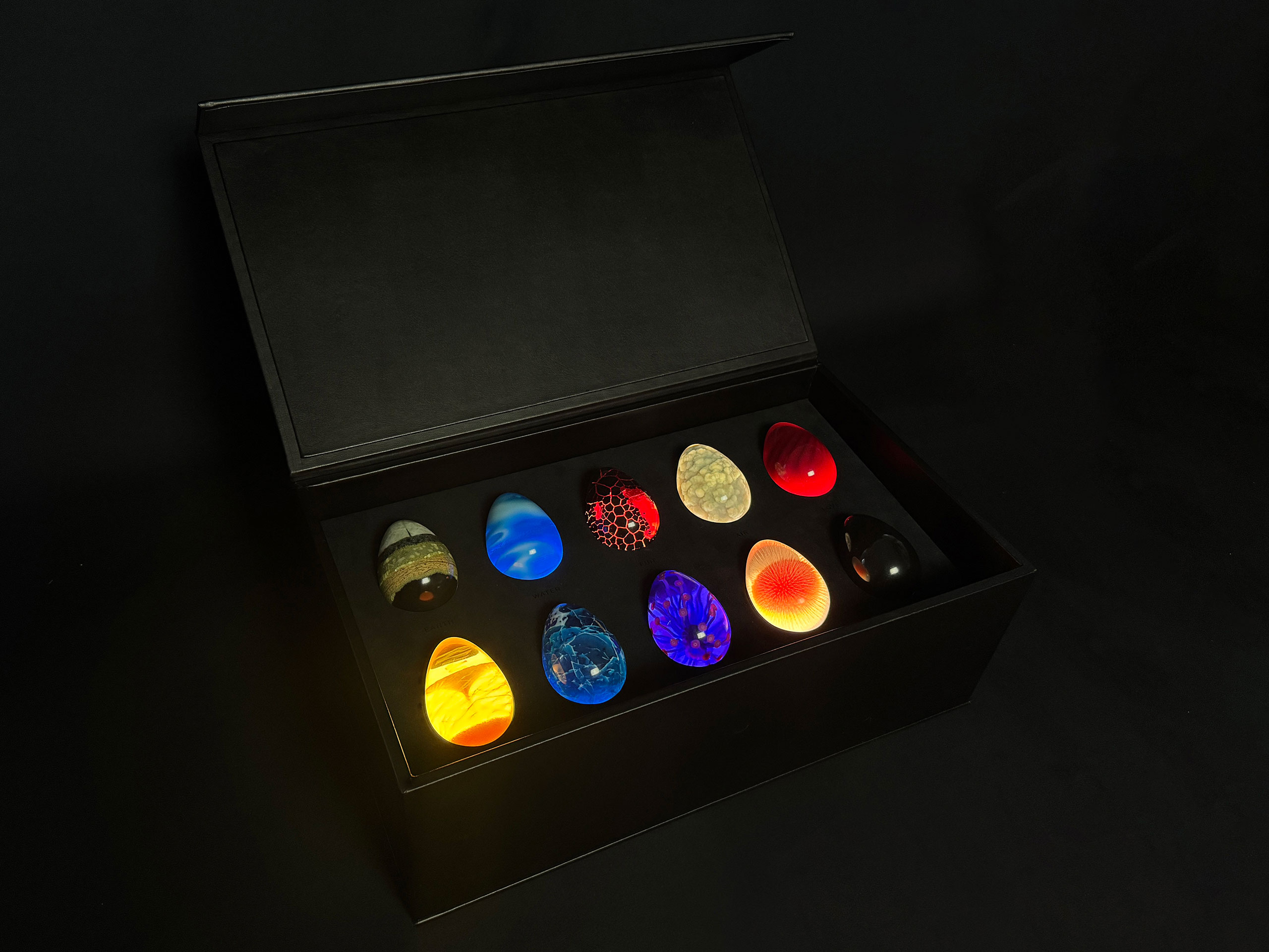 Voxel 3D printed eggs with custom artwork illuminated by custom LED enclosure